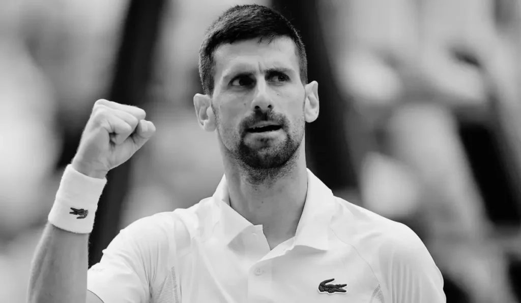 Jack Draper pumping his fist on the tennis court after defeating Novak Djokovic at Indian Wells 2026