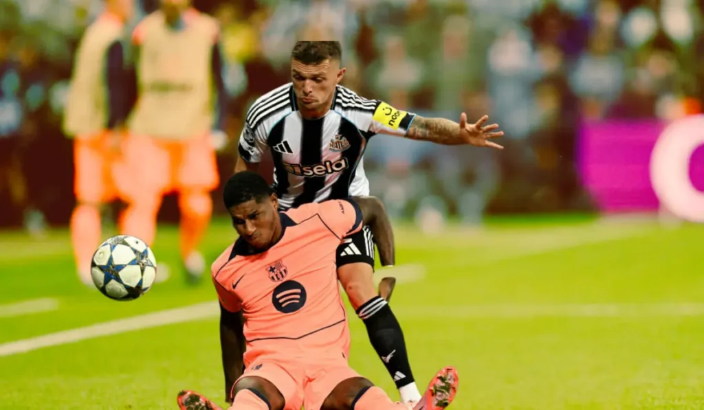 Newcastle United vs FC Barcelona Champions League match atmosphere at St. James’ Park with players battling under the floodlights.